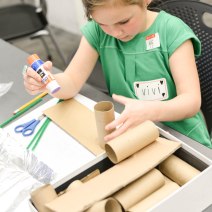 Here is an example of a student using her "Secret Weapons" box of goodies from home to build her model.